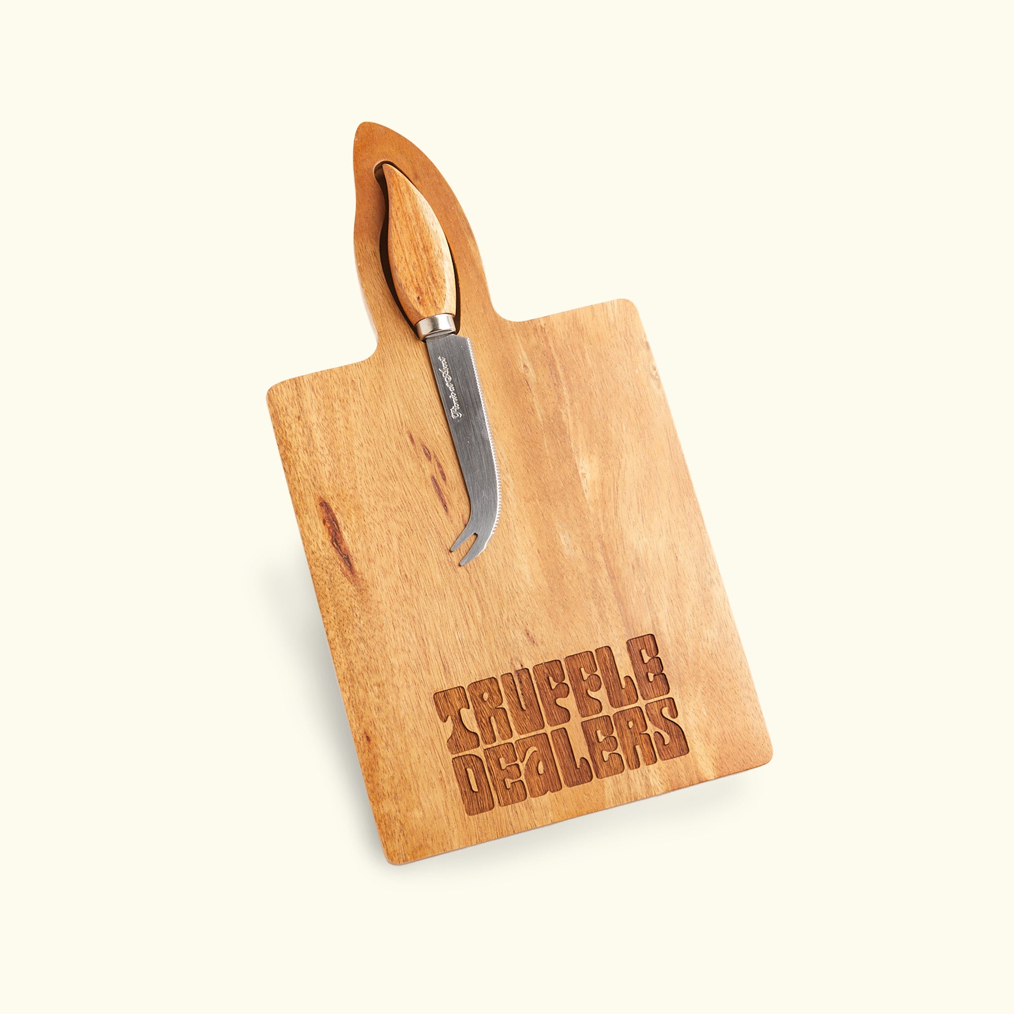 a cutting board with a pair of scissors on it