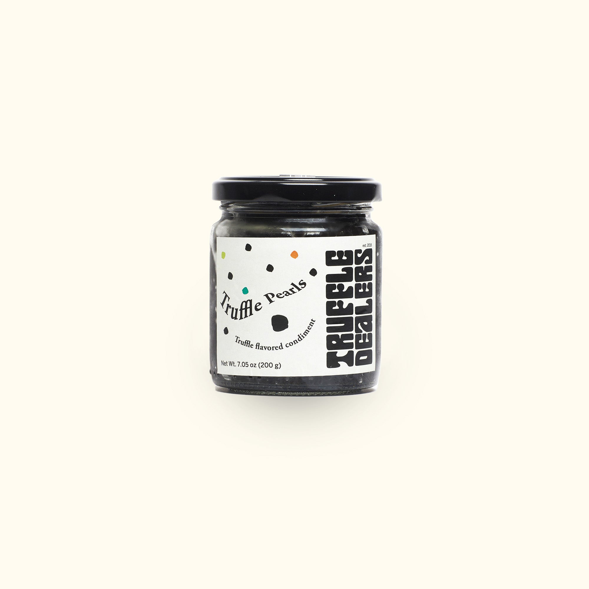 a jar of black food on a white background