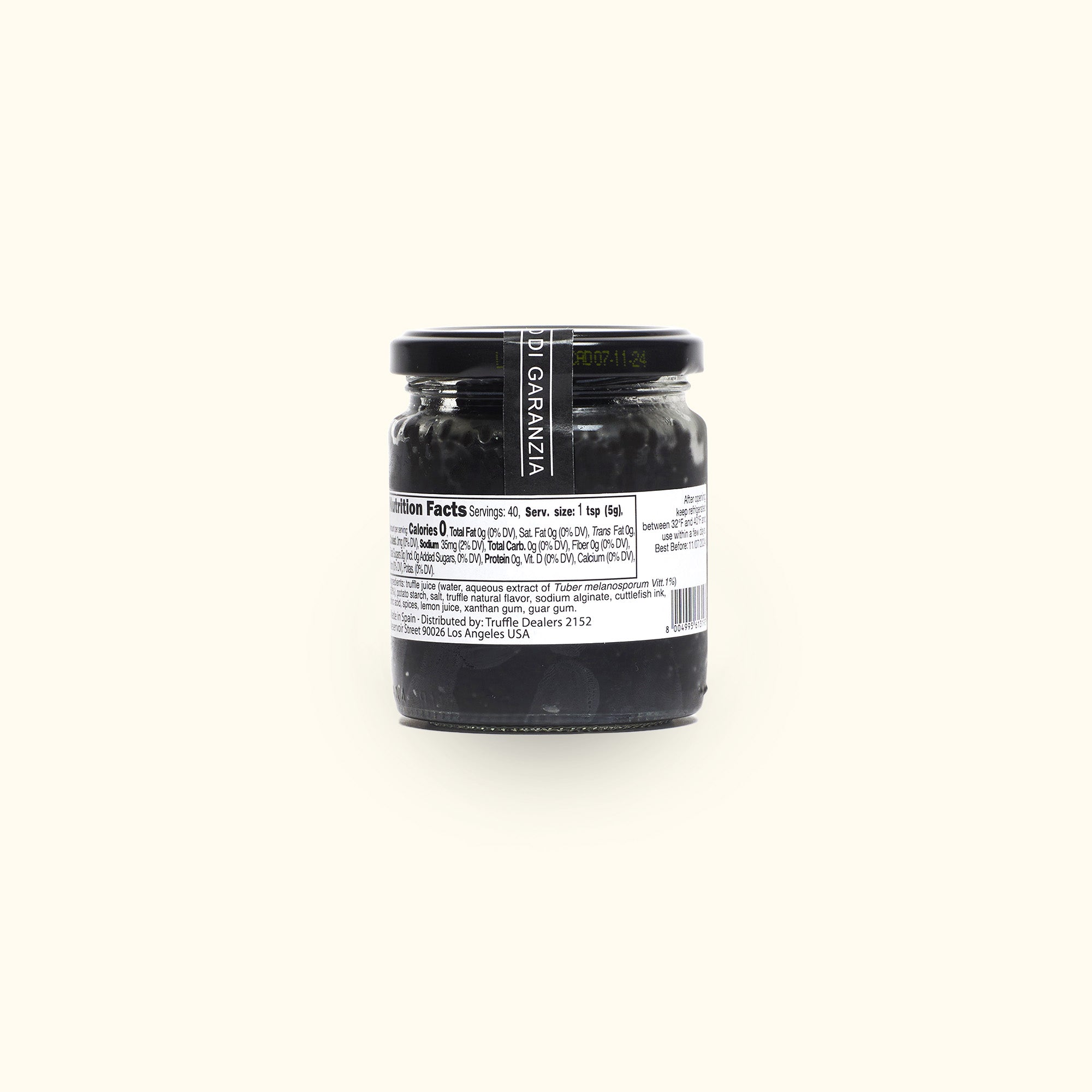 a jar of black food on a white background