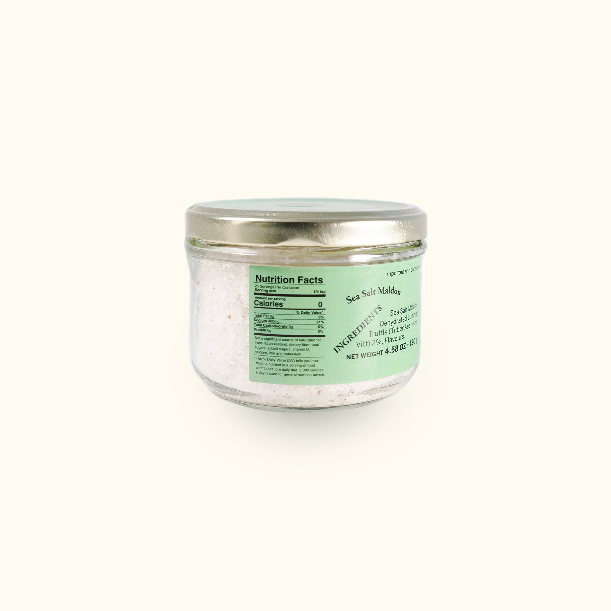 a jar of sea salt on a white background