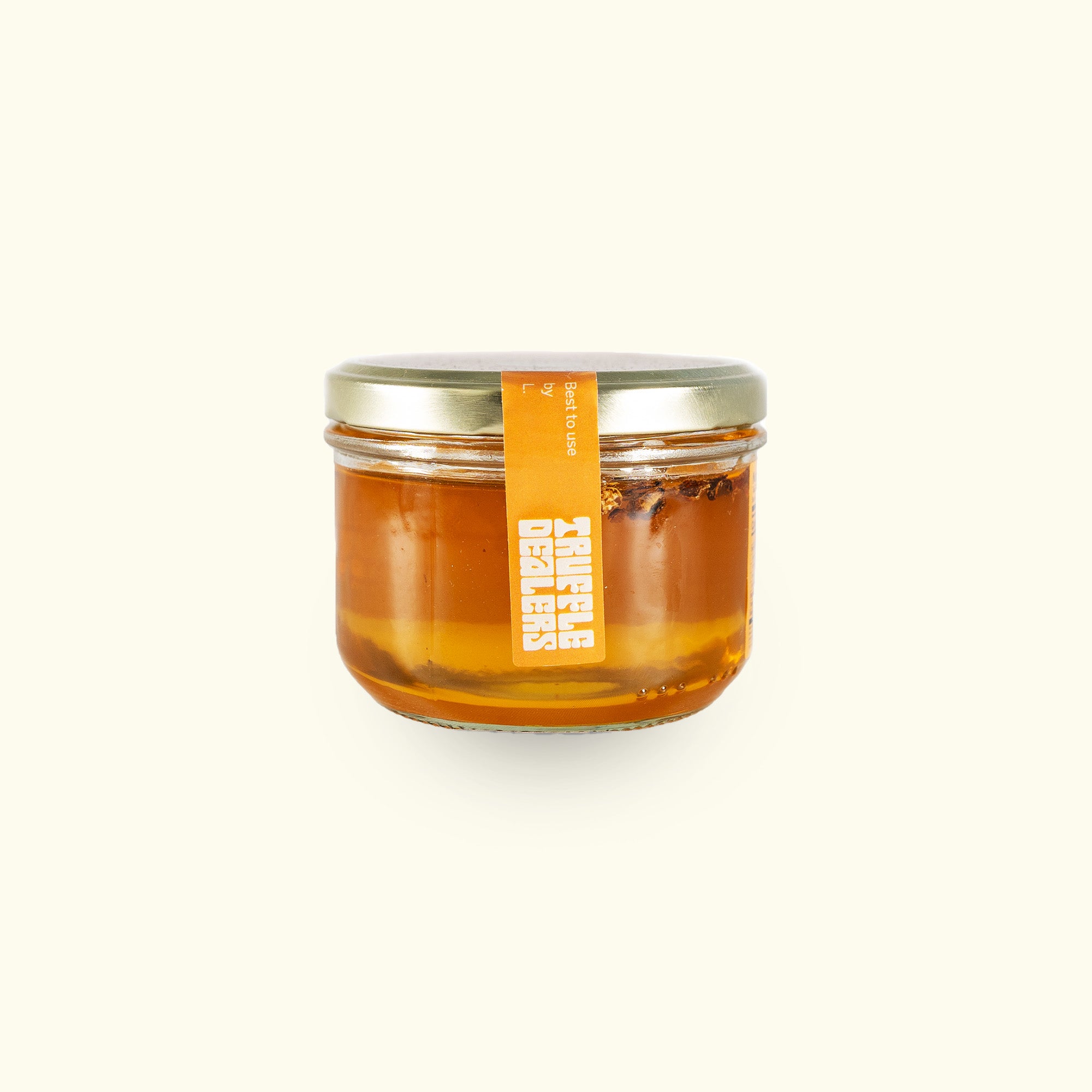 a jar of honey on a white background