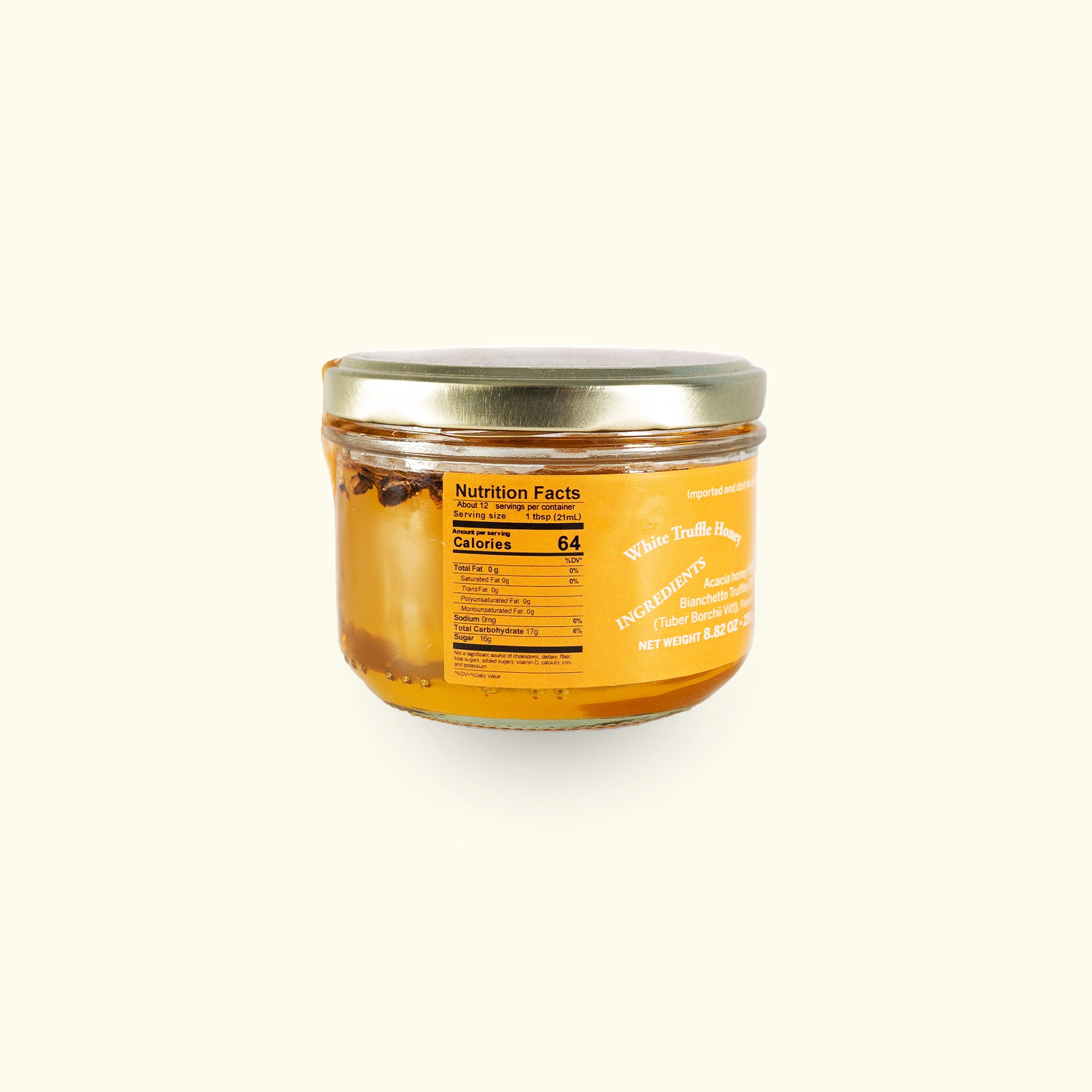 a jar of honey on a white background