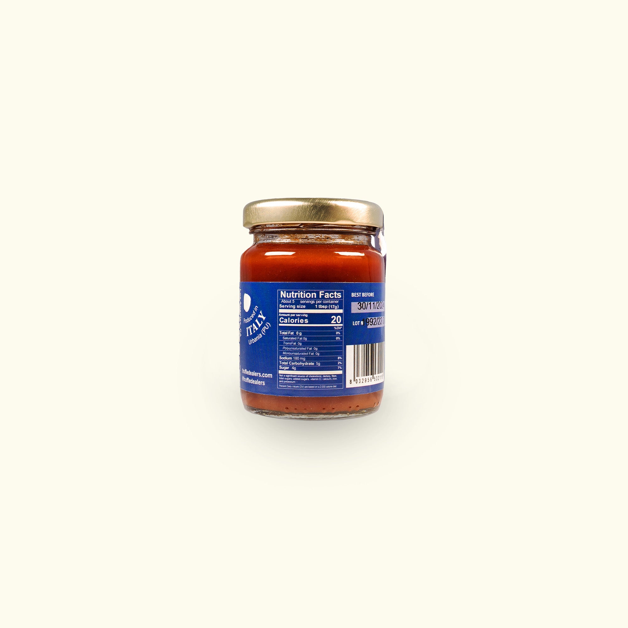 a jar of tomato sauce on a white background