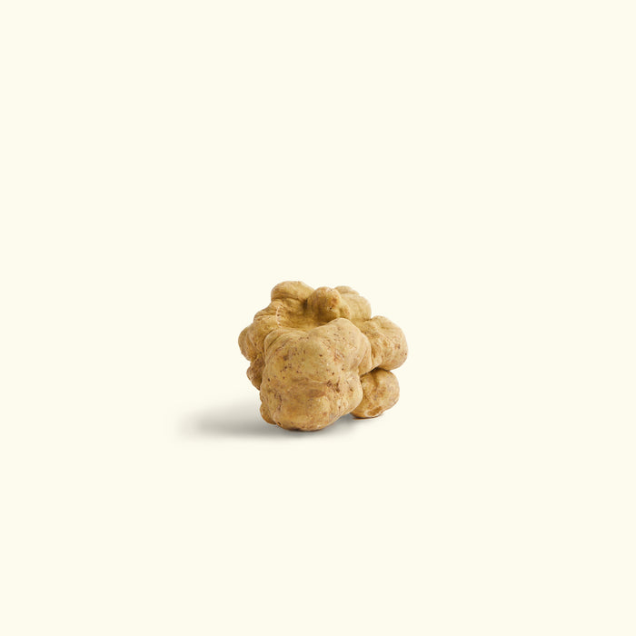 a pile of walnuts on a white background